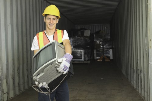 Worker using PPE and handling waste safely